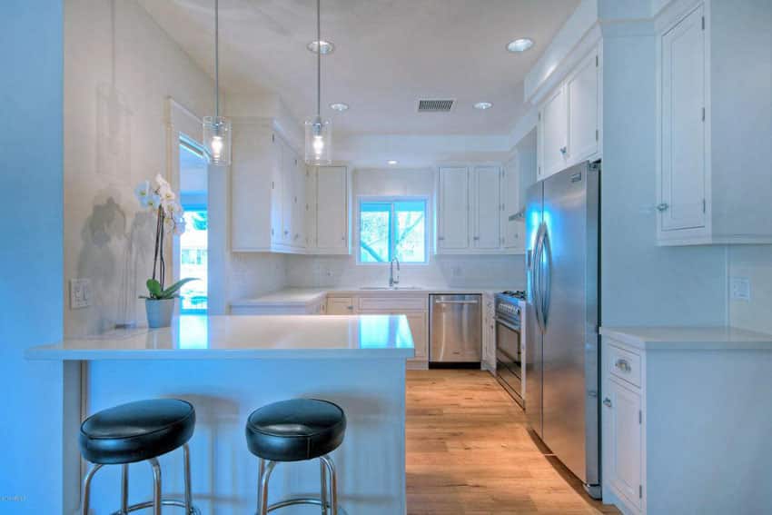 kitchen with black leather stools