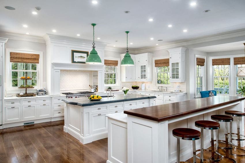 White cabinet kitchen with wood counter breakfast bar island with aro stool seats