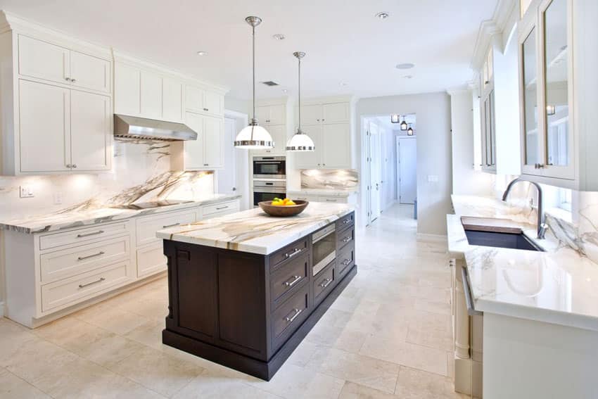 white transitional kitchen with brown cabinet island calacatta gold marble counters and classic pendant lights