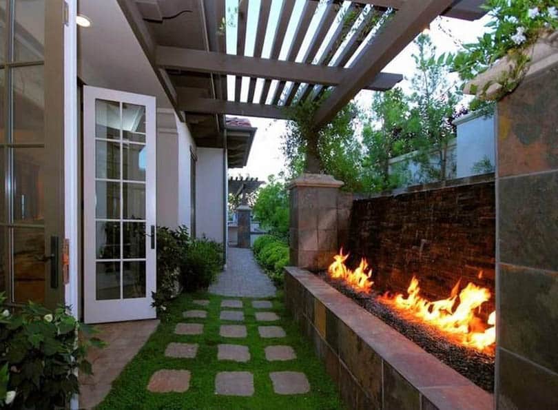 Backyard with gas fireplace and wood pergola