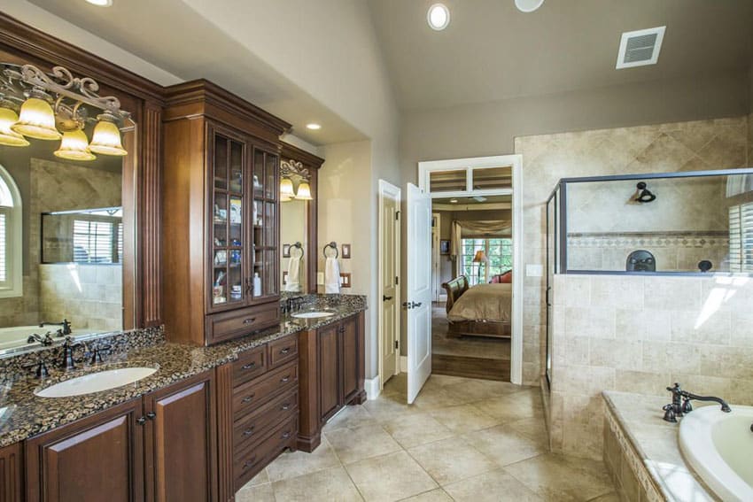 Beautiful bathroom with granite counter vanities and high ceilings