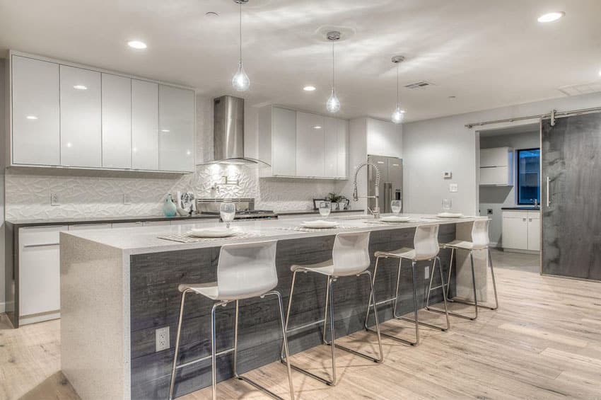 Dark grey base with white quartz countertops and white chairs