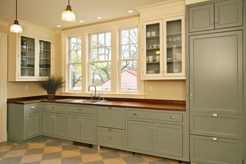 Cottage style one wall kitchen with green flat panel cabinets