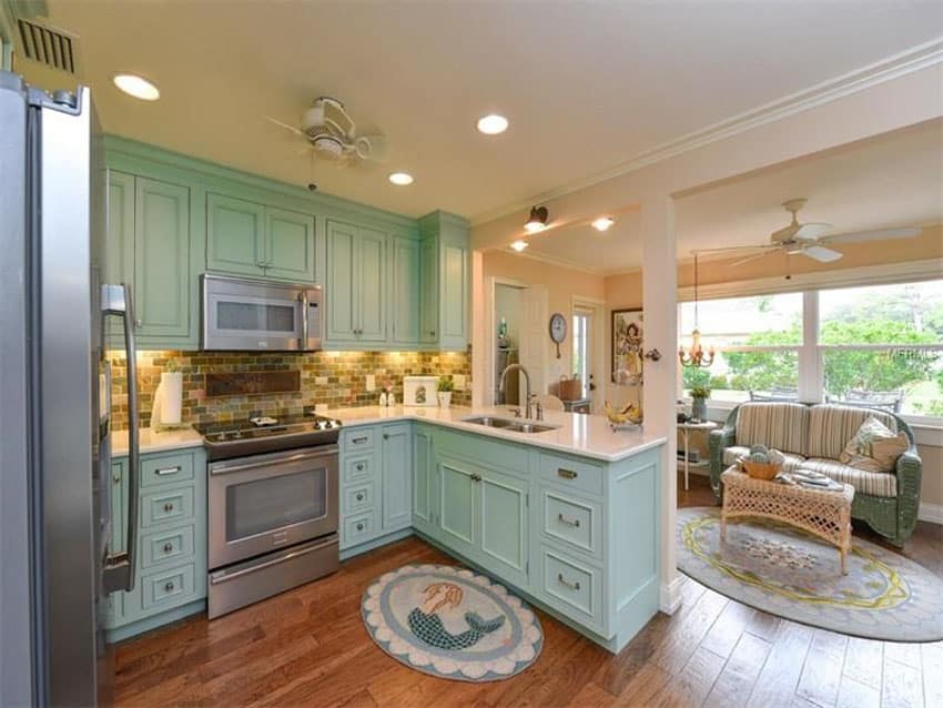 Country kitchen with arctic white quartz counter and mint green cabinets