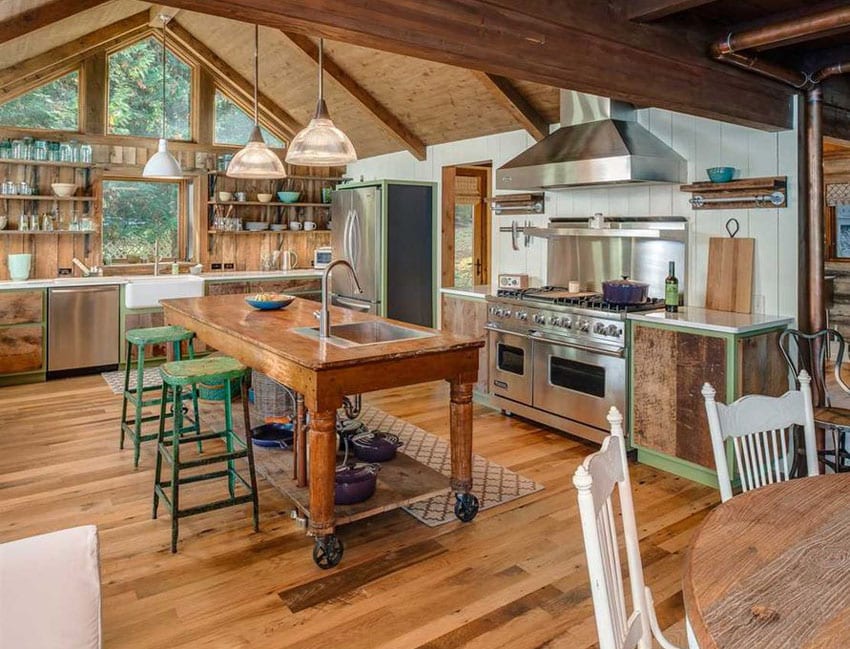 Country kitchen with wood beam ceiling, hardwood floors and rolling island
