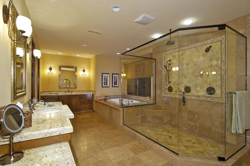 Craftsman bathroom with bronze frame shower, travertine tile, granite counter and wood cabinetry