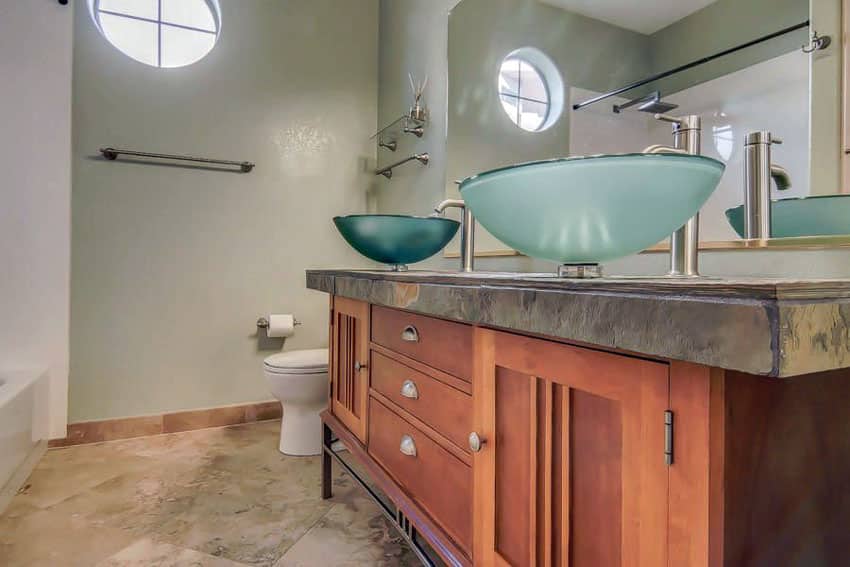 Craftsman bathroom with tempered glass sinks