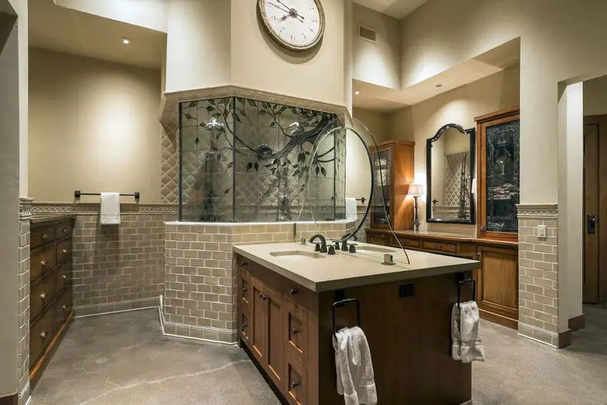 Craftsman master bathroom with brown marble counter vanity and marble wall tile