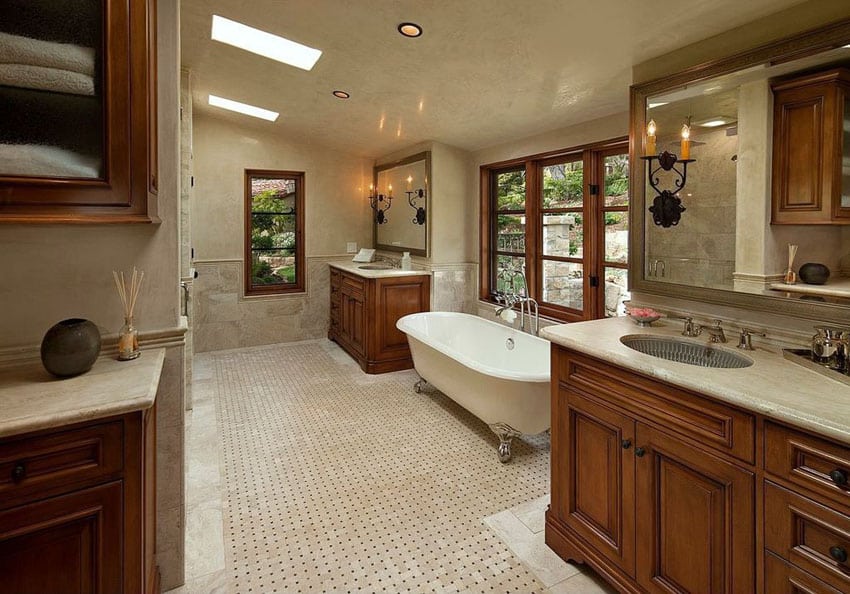 Bathroom with cast iron clawfoot tub, widow and skylight