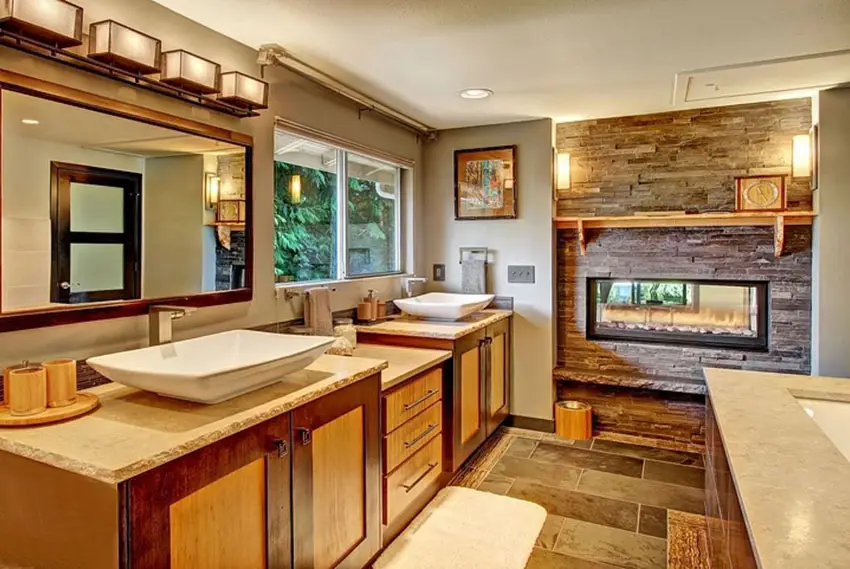 Craftsman master bathroom with stacked stone fireplace and vessel sinks