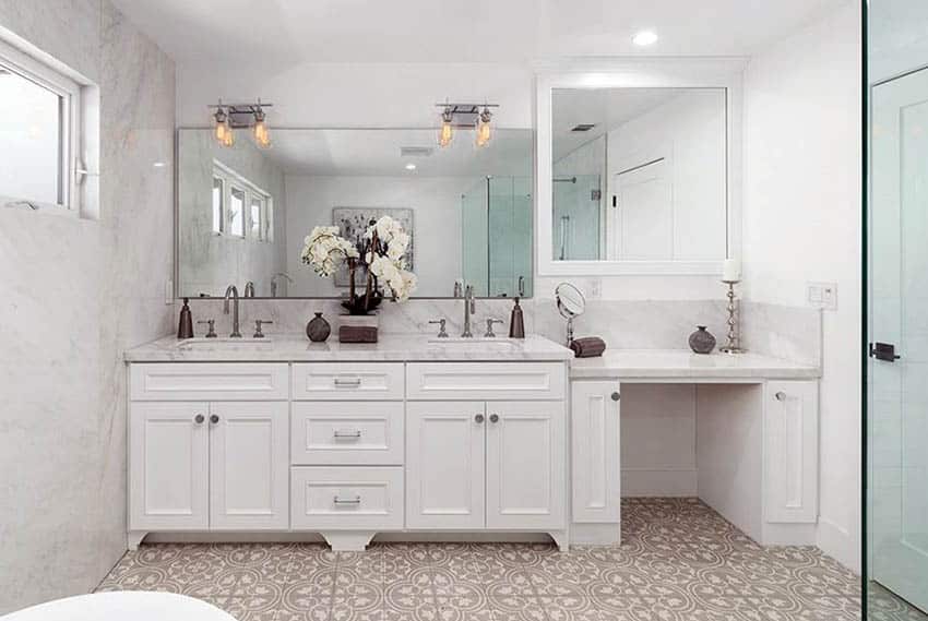 Custom bathroom with marble dual sink vanity and mosaic pattern ceramic floor tile