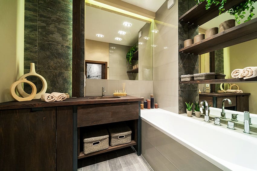 Eclectic bathroom with rustic wood vanity and shelving over bathtub