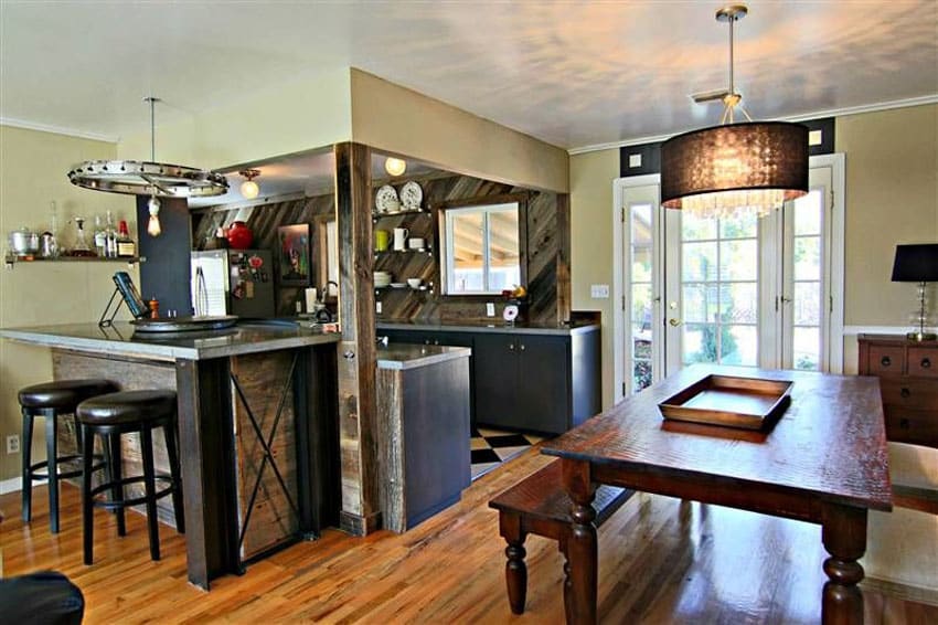 Kitchen with counter with black steel beams and capiz drum chandelier over dining table