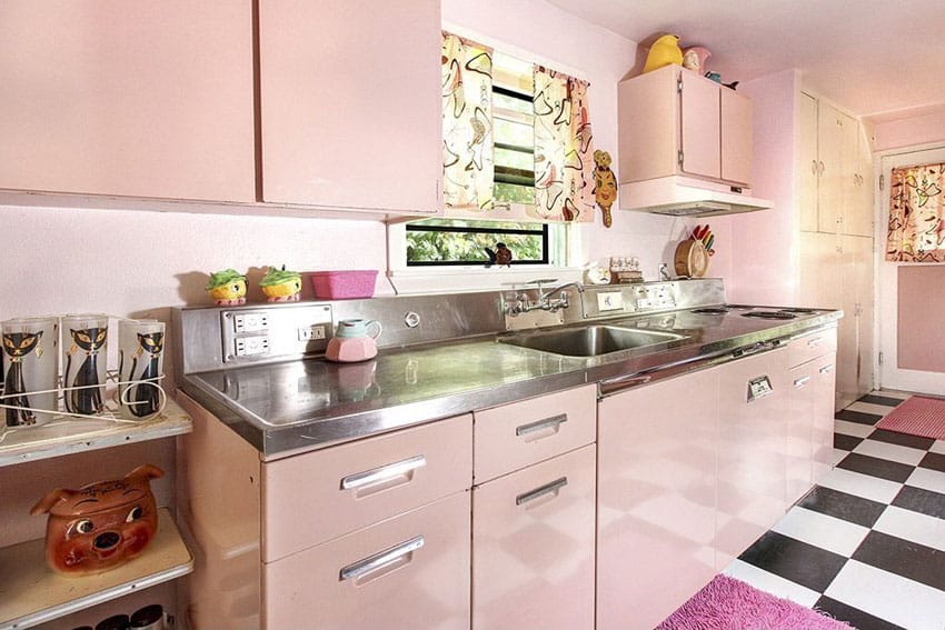 Pink kitchen with retro cabinets and checkered pattern floor