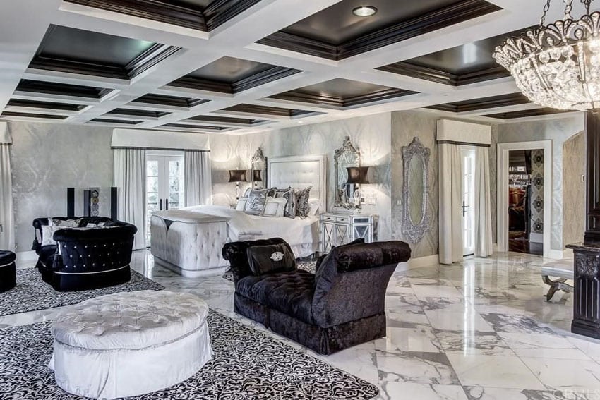 Elegant modern bedroom with black and white theme, coffered ceiling and upholstered furniture 