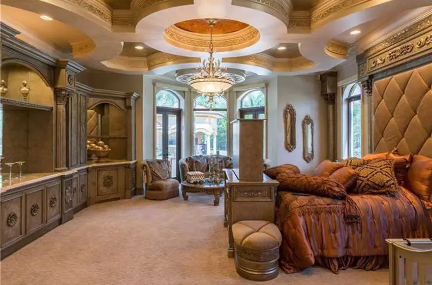 Baroque style bedroom with coffered feature ceiling with center cupola and bed with gold inlay