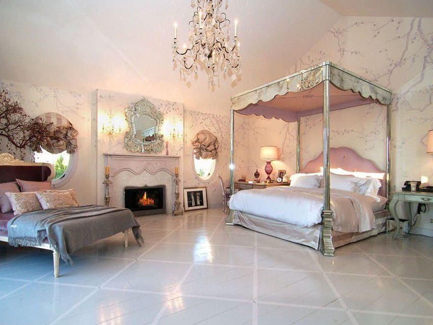 Luxury bedroom with four poster bed, pink color theme chandelier and day bed