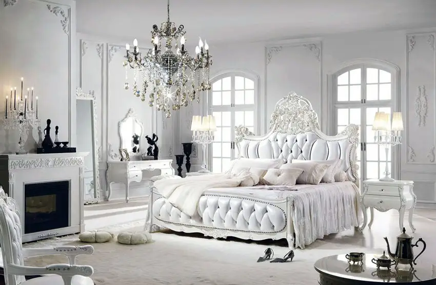 Romantic bedroom with French style, tufted headboard bed, fireplace, chandelier and make-up vanity