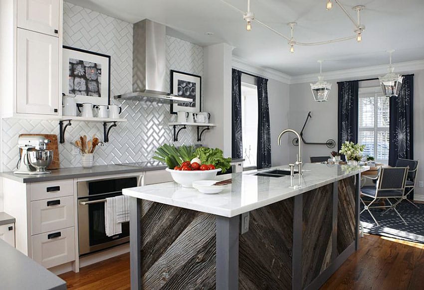 Kitchen with rustic distressed wood island, white backsplash and white marble counter