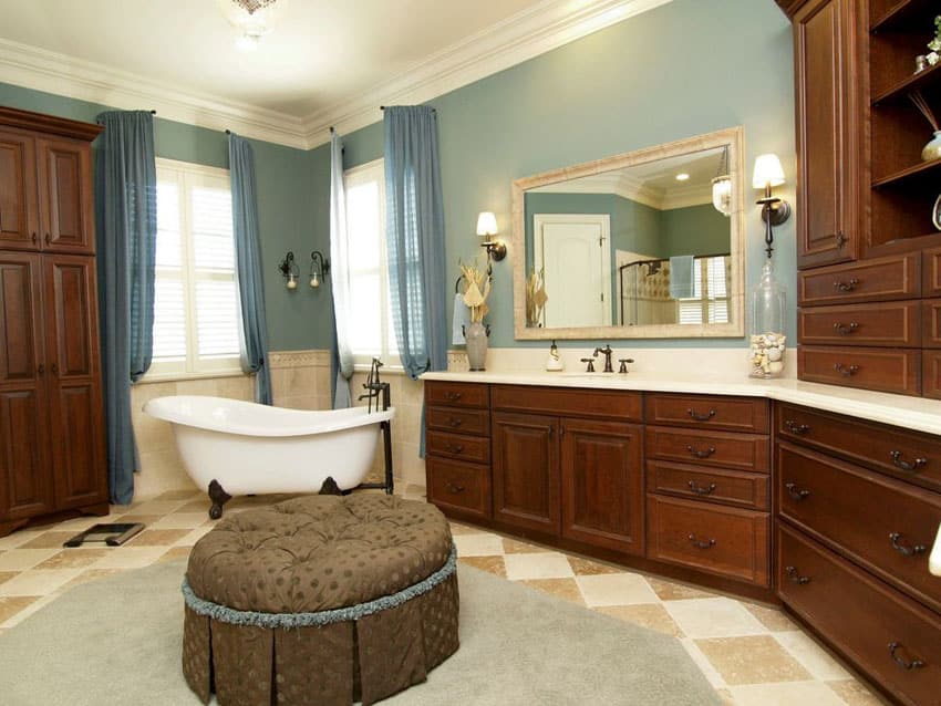 Traditional bathroom with clawfoot tub and decorative wood vanity