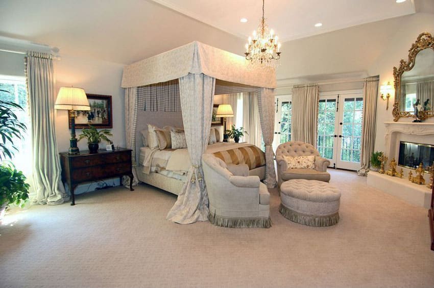 Traditional master bedroom with french doors and four poster bed