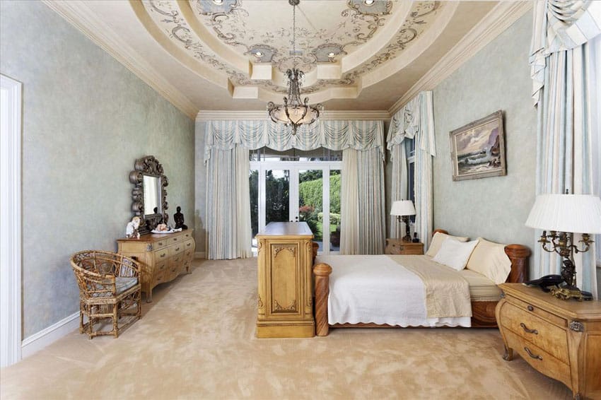 Traditional master bedroom with vintage furniture pieces and raised tray ceiling