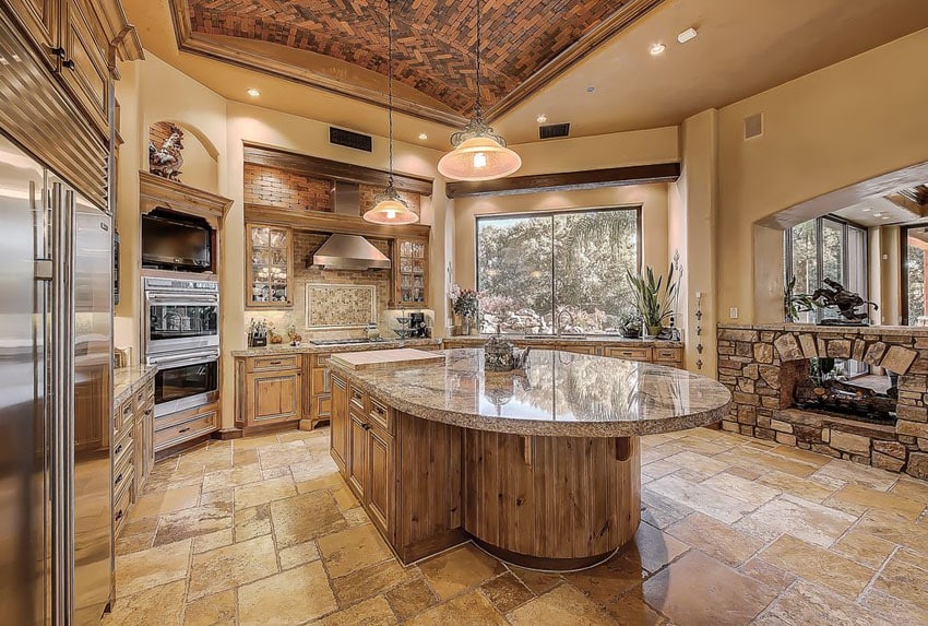Kitchen with custom island, santa cecelia granite and tuscany chateaux travertine floor tile