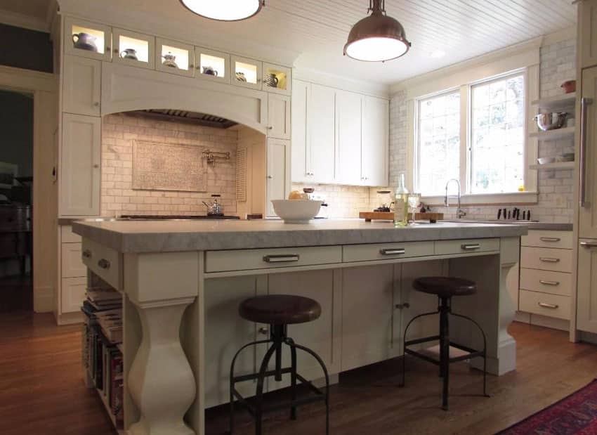 White country kitchen with breakfast bar island marble subway tile and bead board ceiling
