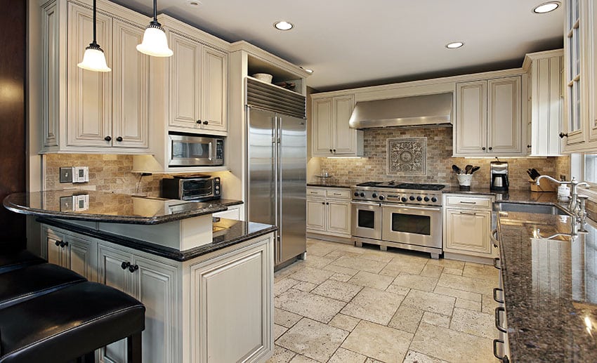 Antique White Kitchen Cabinets With Breakfast Bar Peninsula And Dark Granite Counter 