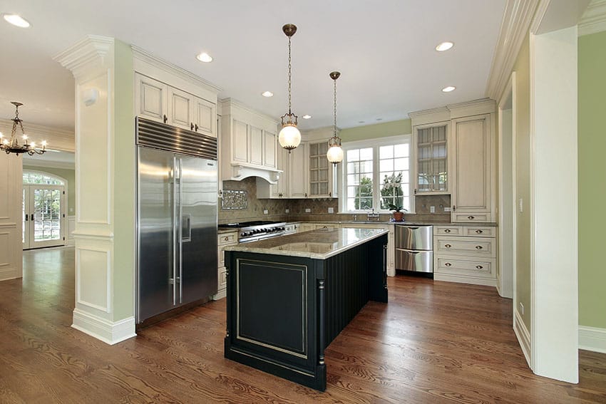 Kitchen with mint green walls and glass framed display cabinets