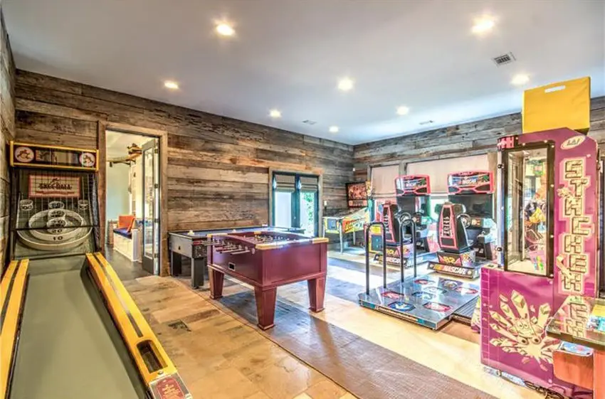 Arcade games with wood accent wall