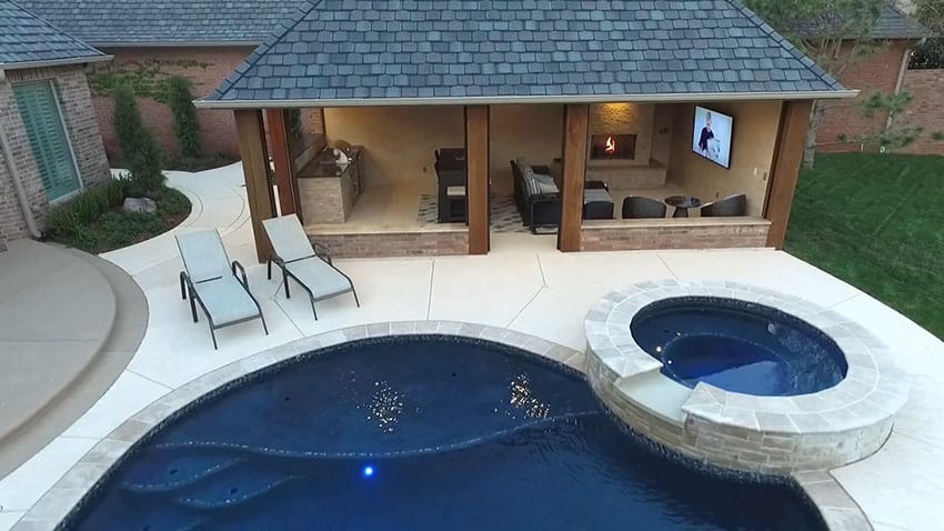Backyard cabana with kitchen fireplace tv net to pool spa