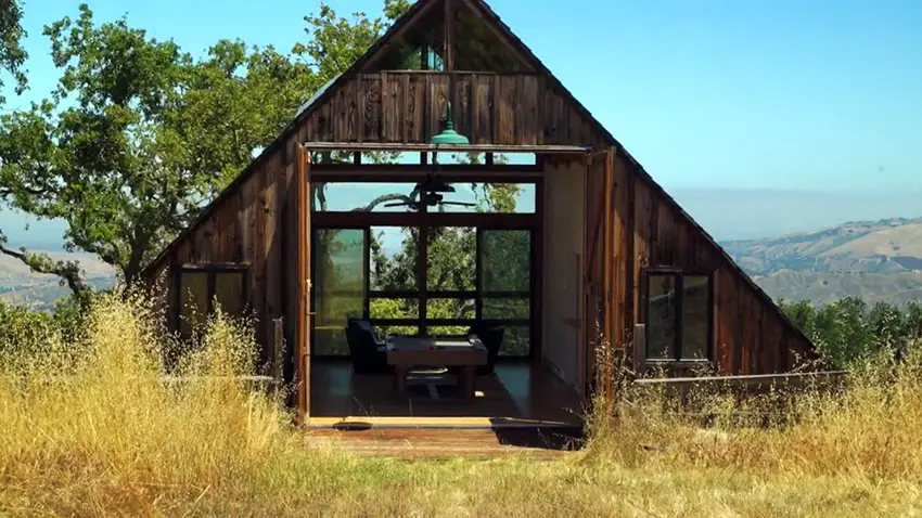Rustic barn in backyard with a-frame ceiling