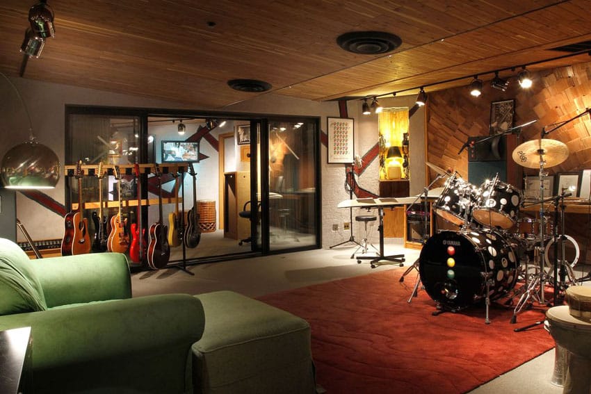 Basement man cave music room with guitars and drums