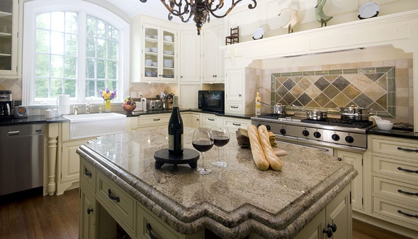 Beautiful kitchen with antique white cabinets, custom island with granite countertop