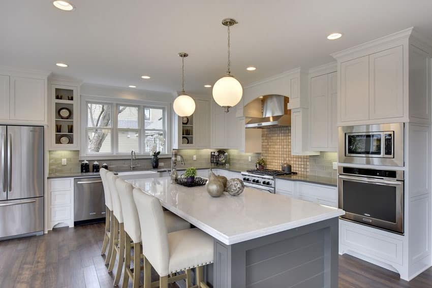 white kitchen with light grey island