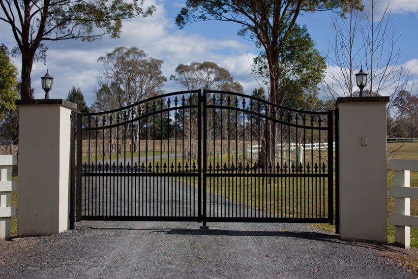 Black wrought iron gate at driveway