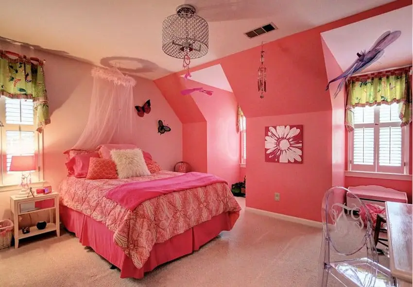 Bright cheerful pink girls bedroom with princess canopy