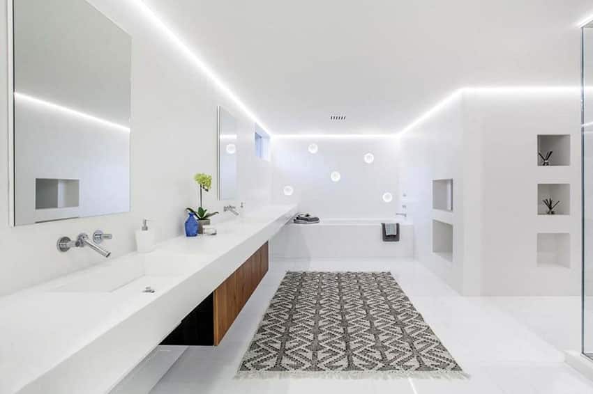 Bright white painted bathroom with long vanity