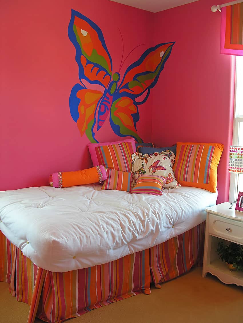 Colorful girls room with large butterfly wall mural