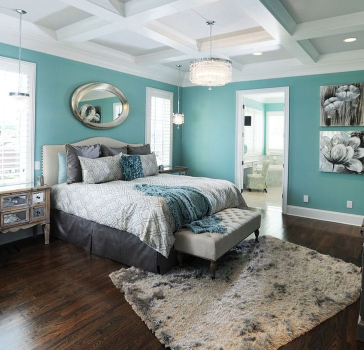 Contemporary bedroom with mirror, dressers, wood flooring and shag drum and pendant lights