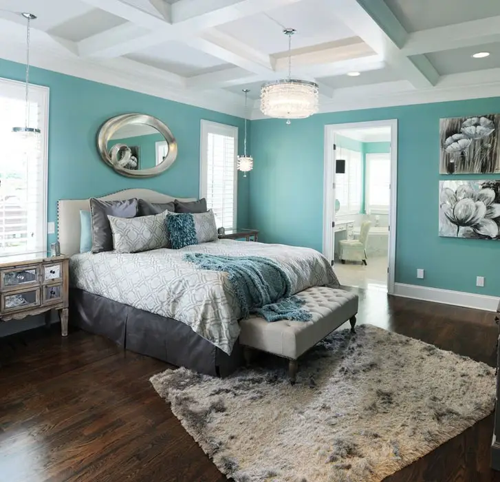 Contemporary bedroom teal walls, mirror dressers, wood flooring and shag drum pendant lights