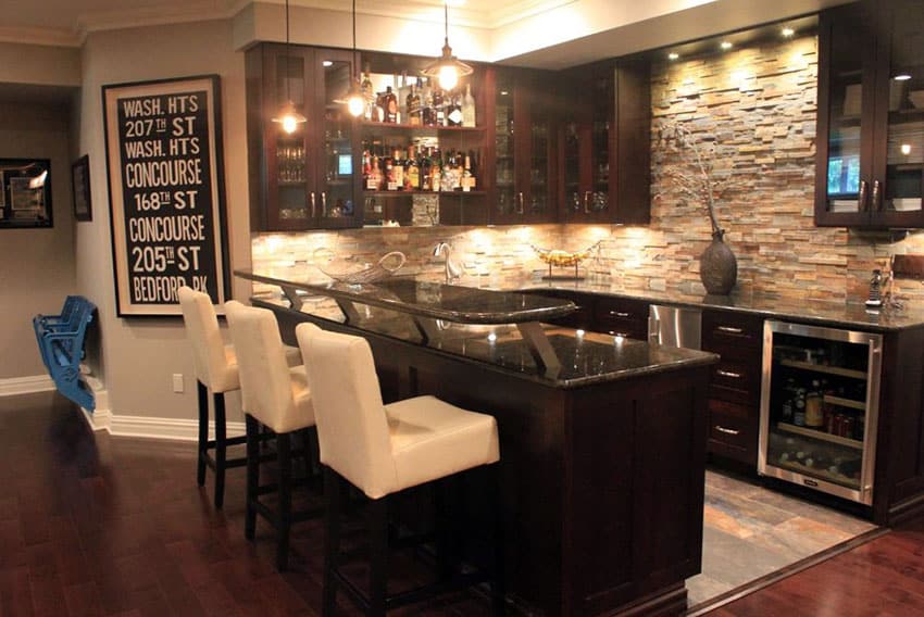Contemporary home wet bar with dark cabinets and fridge