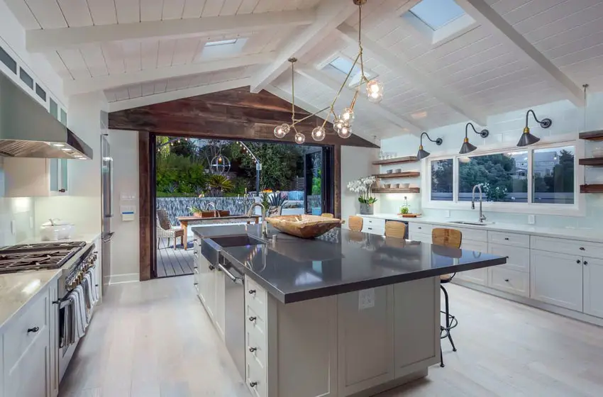 Kitchen with stainless steel island and cathedral ceiling