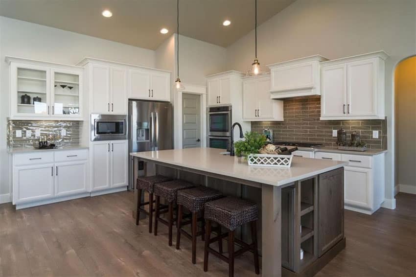 Cottage Kitchen With Dark Island And White Cabinets 