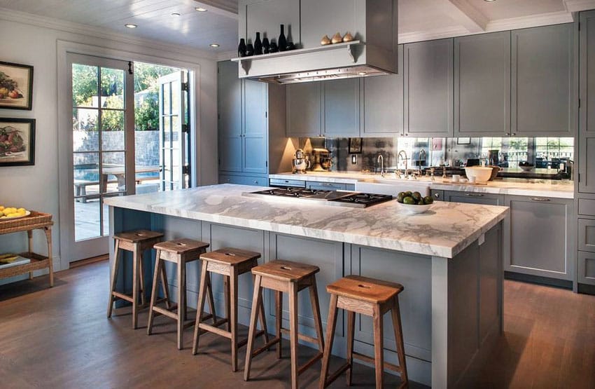 Kitchen with gray colored cabinets and French doors leading to the patio