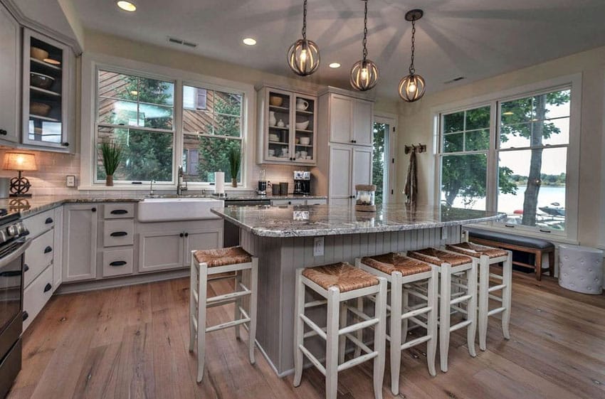 Kitchen with island, wood flooring, and farmhouse sink