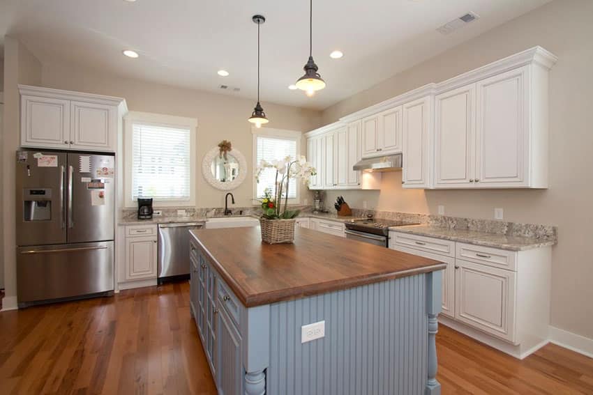 Cottage kitchen with powder blue-painted island 