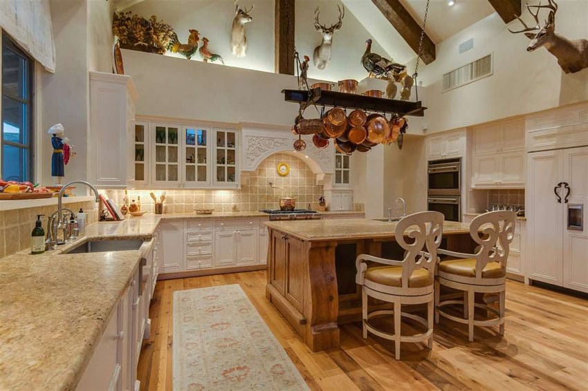 Kitchen with vaulted ceiling, hickory wood floors and siena beige granite counters