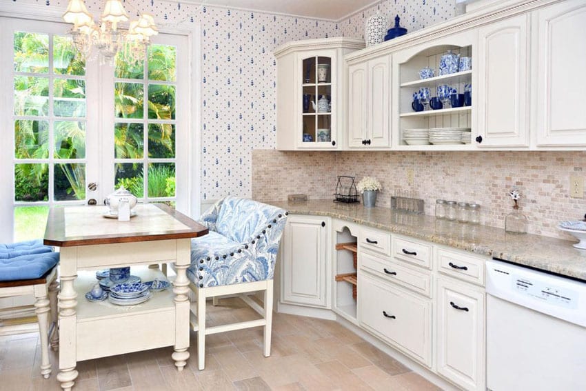 Country kitchen with breakfast nook, white cabinets, appliances, cambridge white granite, and window seat dining table